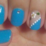 Unhas decoradas com Filha Única em destaque